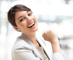 Pretty young business woman smiling