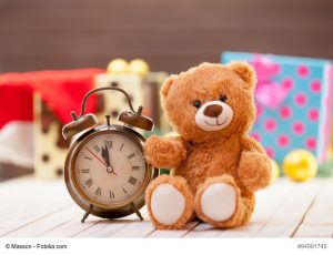 Alarm clock and teddy bear